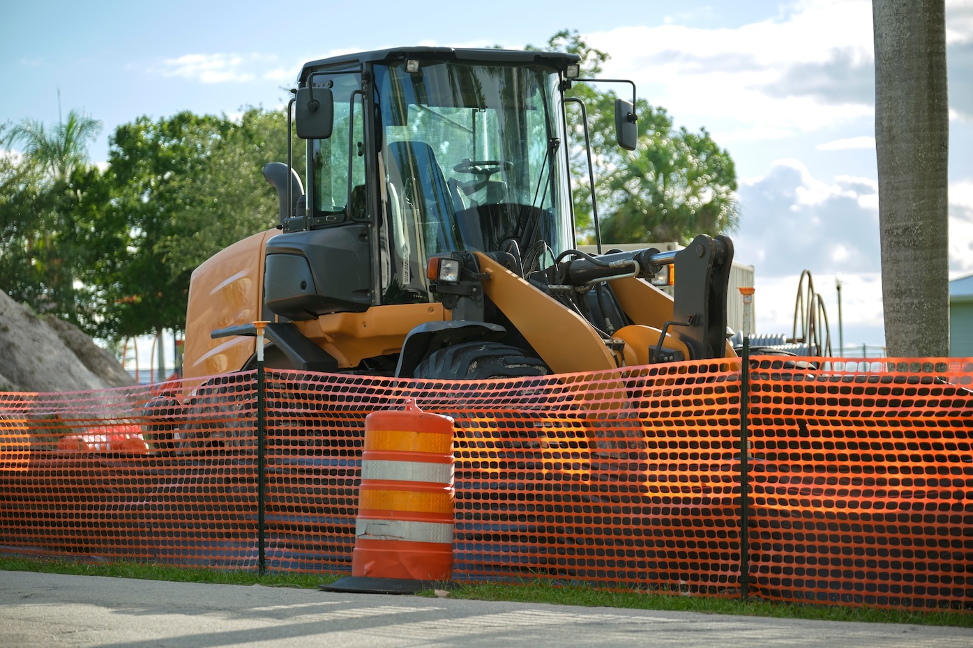 Restriction plastic mesh fence at industrial construction site. Protective barrier for pedestrians safety